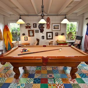 Game Room Image with Betsy Ross flag, pool table, white painted walls, nice looking furnitures and decors